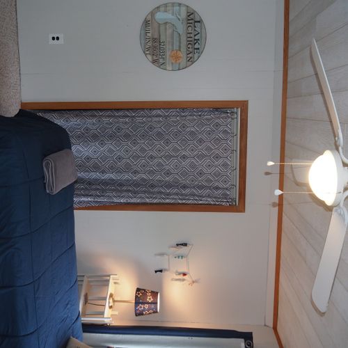 Bedroom #4 (second floor):  features 3 twin-size beds, nightstands with lamps, ceiling fan, closet, dresser, chair, and its own private television.