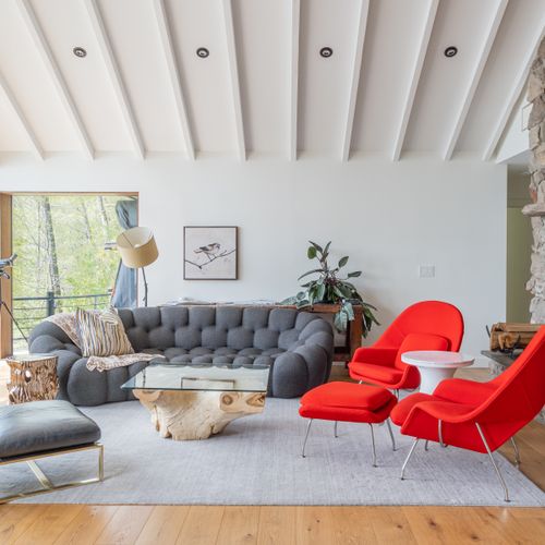 Lounge at ease between sweeping views and roaring fire.