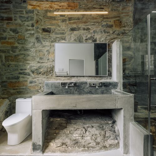 This remarkable bathroom highlights the original stone used to construct The Rifton.