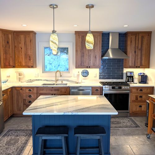 OVERVIEW:  The home has a new and modern kitchen on the main floor with all appliances including a dishwasher.  Also includes a coffee bar, kitchen island, and bar stools.