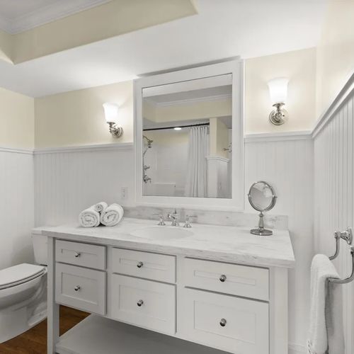 BEDROOM #4 (LOWER LEVEL):  Full bathroom on the lower level with a walk-in shower.