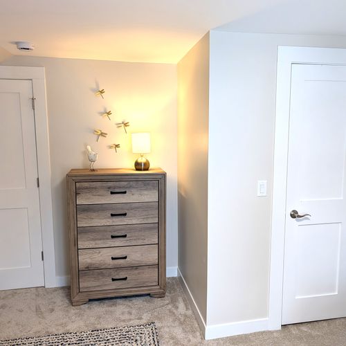 BEDROOM #2 (SECOND FLOOR):  Cute bedroom with two twin beds, table, lamp, dresser, and closet.