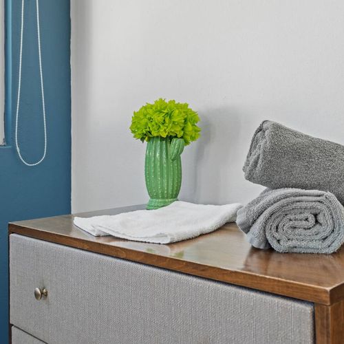 Modern renovated bedroom, huge double bed, soft bedding, bright, window views, airconditioner, modern table lamps and storage space
