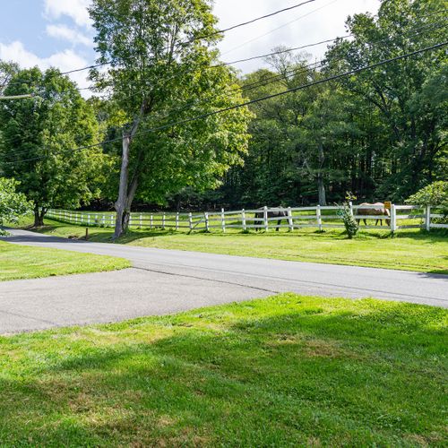 This idyllic horse pasture is steps from the front door