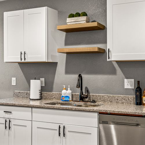 A kitchen that speaks in clean lines, subtle shine, and total functionality.