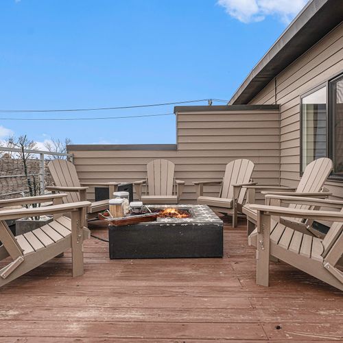 Unwind in style on our rooftop deck, with cozy seating, smores and a charming firepit!