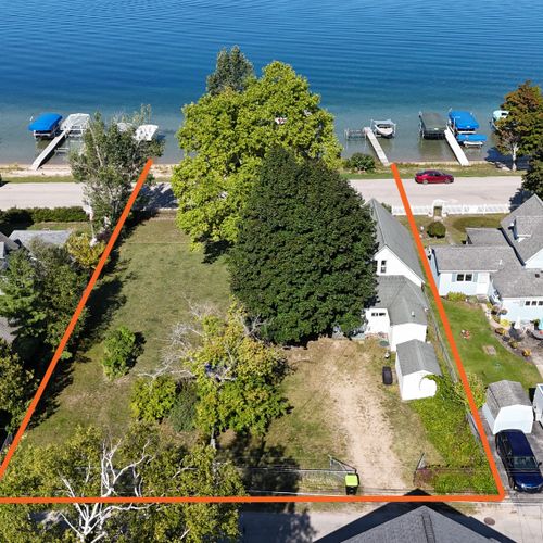 EXTERIOR:  Aerial photo from above the property with the property borders shown in orange
