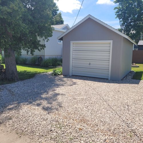EXTERIOR:  The parking area.  (Note that the small garage is not available for guest usage.)