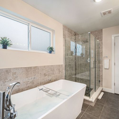 Refresh and rejuvenate in our master bathroom's spacious glass shower.