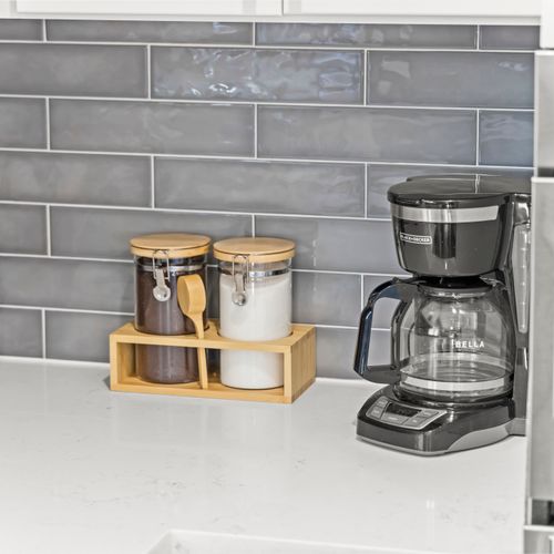 Coffee station fully equipped with essentials to start your day right.