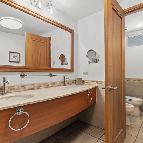 Enjoy the convenience of both a rejuvenating shower and a comforting bath in this well-appointed and pristine bathroom.
