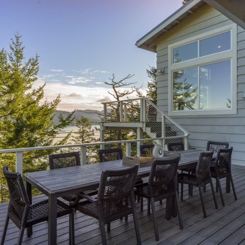 Outdoor seating for twelve guests right outside the dining room makes dining al fresco easy.