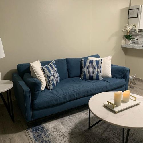 Cozy & Inviting Living Space: Sink into the comfortable sofa, perfect for unwinding after a day of exploring.