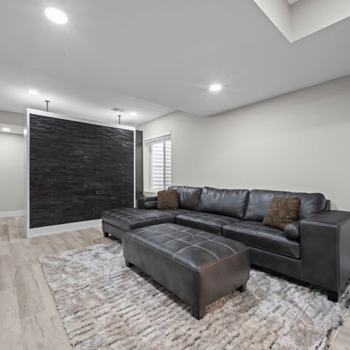 Lower-level lounge built for relaxing, playing, and stretching out comfortably.