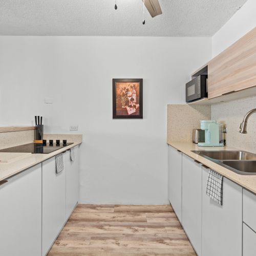 Fully equipped and stylish kitchen ready for your culinary adventures, complete with modern appliances and ample counter space.