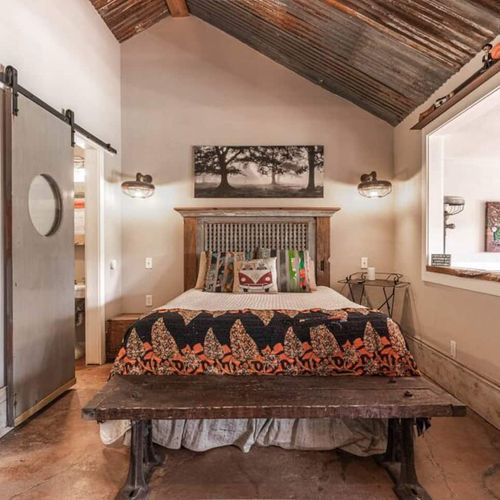 The comfortable queen bed in the cozy bedroom nook in the cabin
