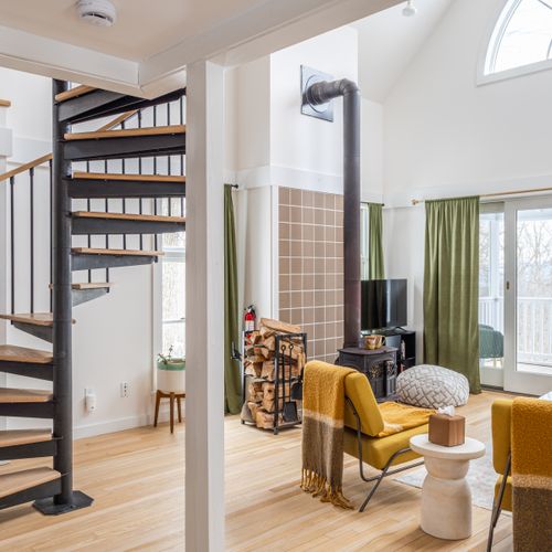 Spiral stairs leading to the loft add to the architectural charm.