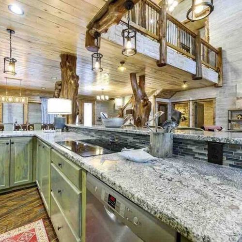 Kitchen is equipped with dual stovetops, two dishwashers and ample counter space