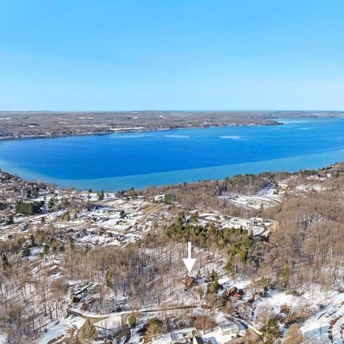 Exterior:  a great aerial photo of the cabin with crystal lake in the background.