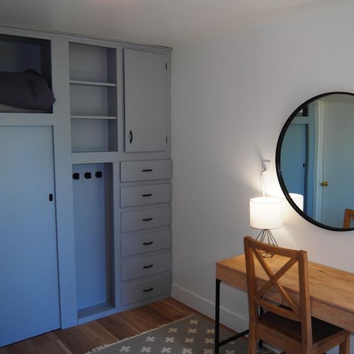 Bedroom #2:  features a queen-size bed, nightstands, desk, and a large wall closet.