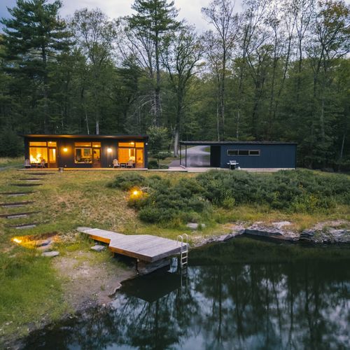 The cozy guest house across the pond with it's own carport