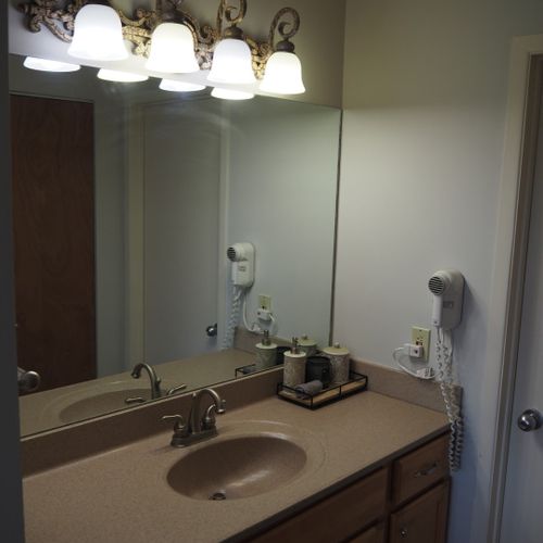 Master bathroom:  this is the private en-suite bathroom for the master bedroom. It's a full bathroom with a combination tub and shower. Note that there is a door that separates the combination tub / shower and toilet from the rest of the bathroom.