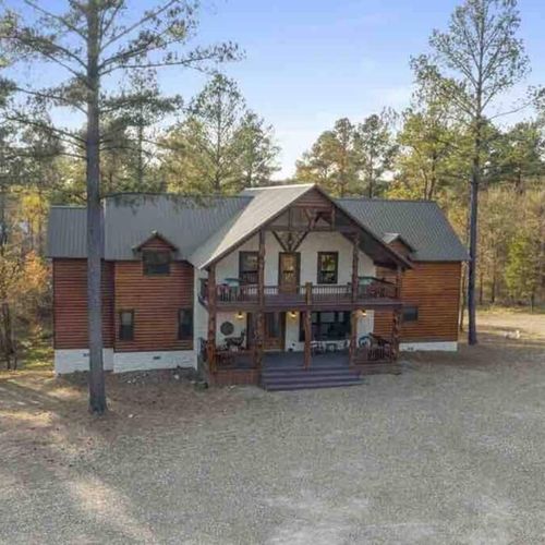 Views of the covered porch and private patio accessible on the upper floor.