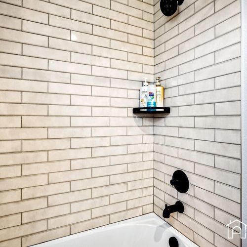 - refresh in this stylish tub shower combo with matte black fixtures and bright subway tile
- wall shelf keeps essentials handy while you soak or rinse off
- crisp modern design perfect for both quick showers and relaxing baths