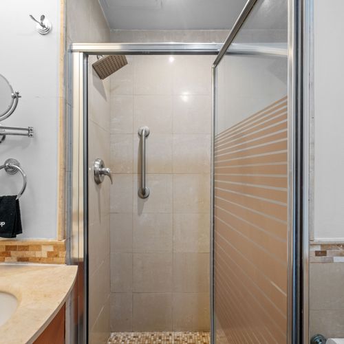 A refreshing space to start your day. Modern and clean bathroom with a walk-in shower.