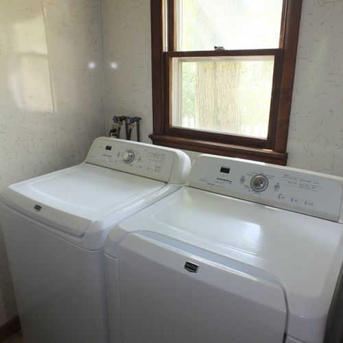 Laundry and mudroom:  convenient laundry room and mudroom with an extra refrigerator. Also includes a half-bathroom.
