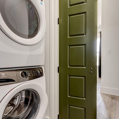 Upstairs laundry room w/ side-by-side washer & dryer for easy convenience.