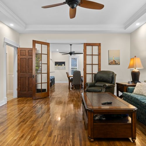 LIVING ROOM #1 (MAIN FLOOR):  The home has a very stylish living room with a very large live-streaming television.