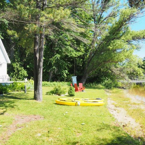 Exterior:  the private lakefront, kayaks, and bonfire ring.