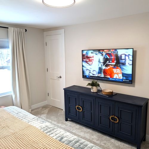 BEDROOM #2 (SECOND FLOOR):  Beautiful newly-decorated second floor bedroom with a king-size bed, private television, nightstands, lamps, dresser, and closet.