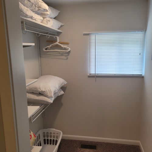 BEDROOM #1:   Master bedroom with a queen-size bed, walk-in closet, private en suite full bathroom, and streaming television.