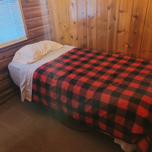 Bedroom #2:  features 2 twin size beds, nightstand, lamp, closet, and dresser
