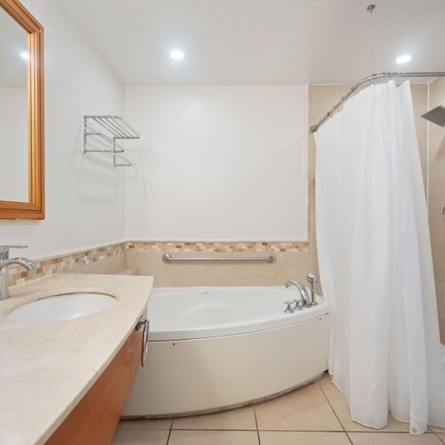 Spacious and elegant, our bathroom offers ample counter space and modern fixtures for your ultimate comfort.