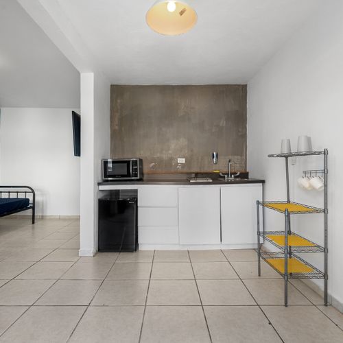 Immerse yourself in the graceful blend of simplicity and refinement showcased in this beautifully adorned kitchen space.