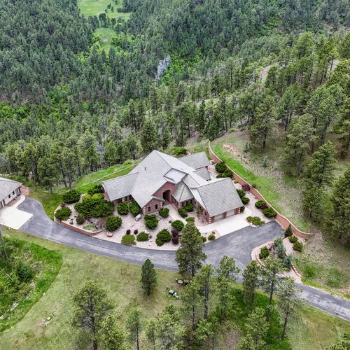 Privacy meets nature in this one-of-a-kind forested hillside estate.