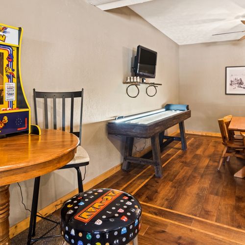 Lower level:  great family space in the lower level with dining table, wet bar, games, sofa, and television.
