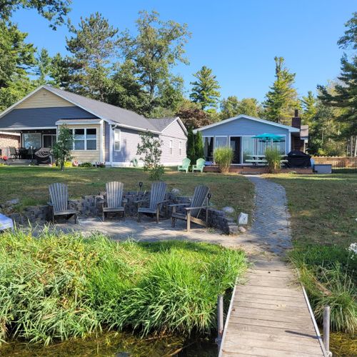 Overall:  looking back from the private dock on the bonfire ring and outdoor deck.