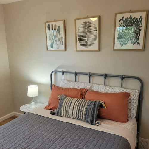 Bedroom #1:  bedroom #1 features a queen-size bed, ceiling fan, dresser, and a closet.