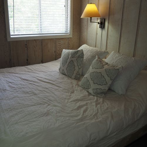Bedroom #1 (first floor):  features king-size bed, dresser, and closet.
