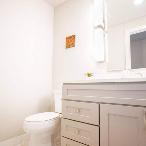 Clean half bath w/ vanity & sink — functional & fresh.