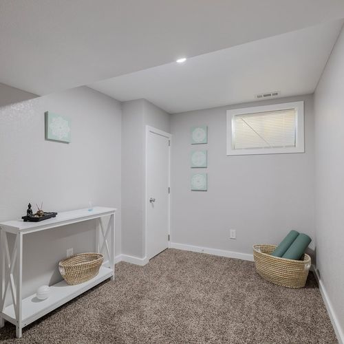 - peaceful yoga or meditation nook with mat, props, and a calming neutral design
- soft carpeted flooring and minimal decor create a clean and restful atmosphere
- ideal for stretching, mindfulness, or unwinding with a gentle home workout