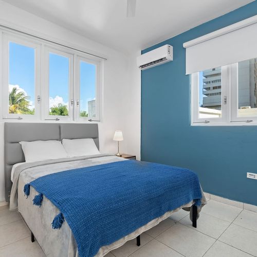 Modern renovated bedroom, huge double bed, soft bedding, bright, window views, airconditioner, modern table lamps