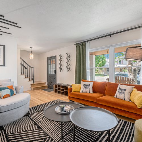 Step into this inviting living space just off the entryway. Featuring stylish decor, comfortable seating, and warm lighting, it's the perfect place to relax and welcome guests to your home away from home.