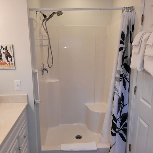 Bathroom #2 (upper level):  full bathroom that is a private en suite bathroom for bedroom #2