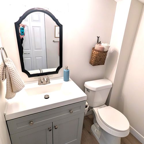 BATHROOM #2 (MAIN FLOOR):  This is a very convenient half-bathroom off of the kitchen.  It also includes a laundry closet with a stacked washer and dryer in it.