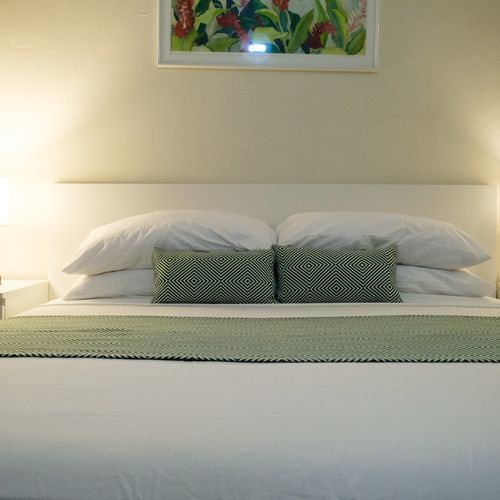 Discover a warm and welcoming atmosphere in this charming bedroom, perfect for unwinding and feeling right at home during your visit.